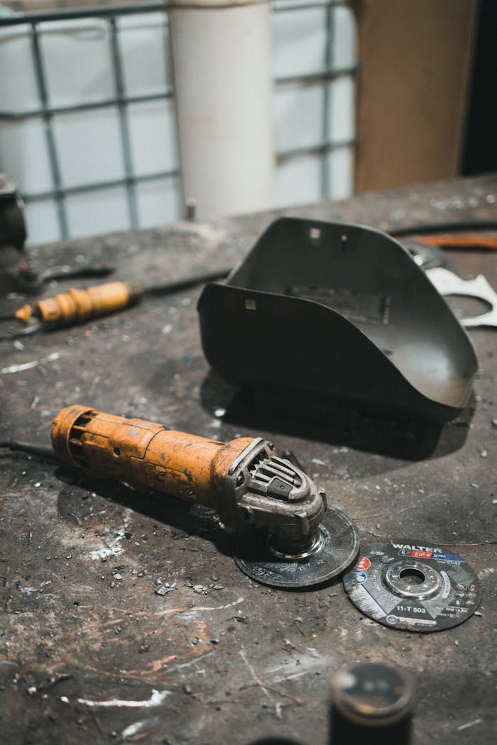 industrial-table-with-tools-and-grinder-32298302